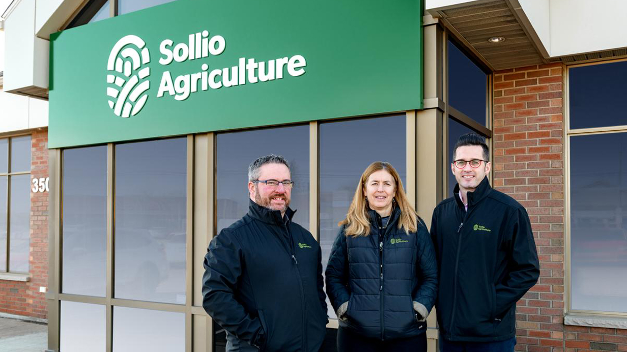 Marty Donnelly and his colleagues smile in front of the Sollio Agriculture facility in Moncton