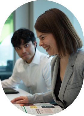 Two Human Resources employees who enjoy working at the office.